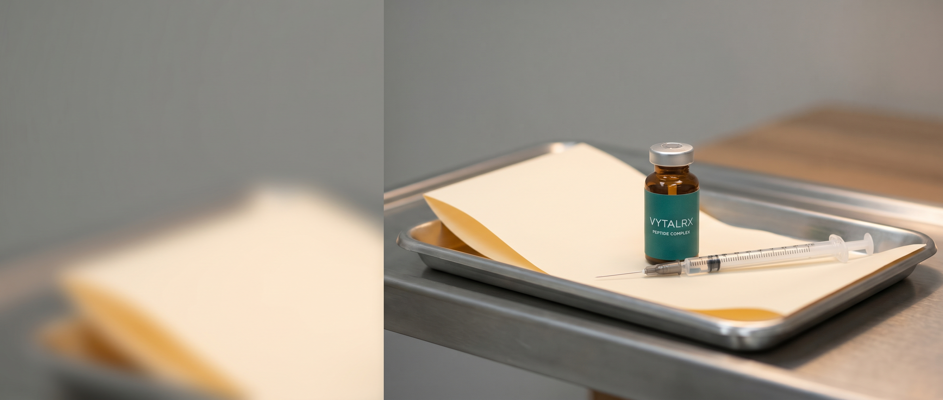 A small amber-glass peptide vial and a single clean syringe organized on a stainless clinical tray — VytalRx wellness and peptide category